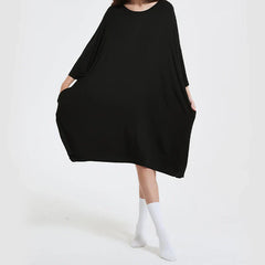 Oversized black bamboo sleep tee with pockets, Snuglfit™ super soft and moisture-wicking.