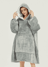 Light grey SNUGLFIT™ hoodie blanket, plush Sherpa fleece interior, oversized wearable comfort.