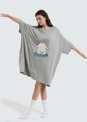 Snuglfit™ Oversized Zen Cat Sleep Tee in bamboo fabric, featuring a relaxed fit on a model with arms outstretched.