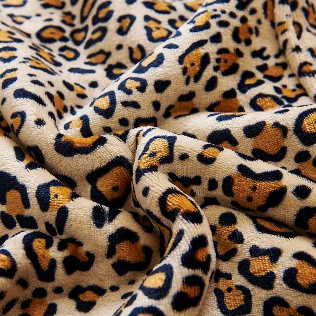 Leopard print fabric detail of SNUGLFIT™ Hoodie Blanket.