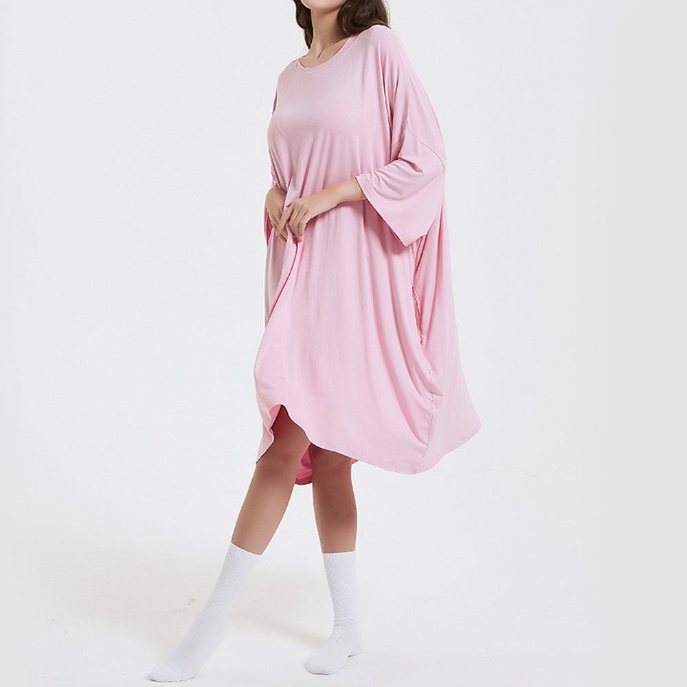 Oversized baby pink bamboo sleep tee with side pockets, moisture-wicking, and heat-regulating fabric.