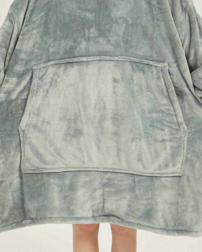 Light grey SNUGLFIT™ Hoodie Blanket with large front pocket, cozy fleece material.