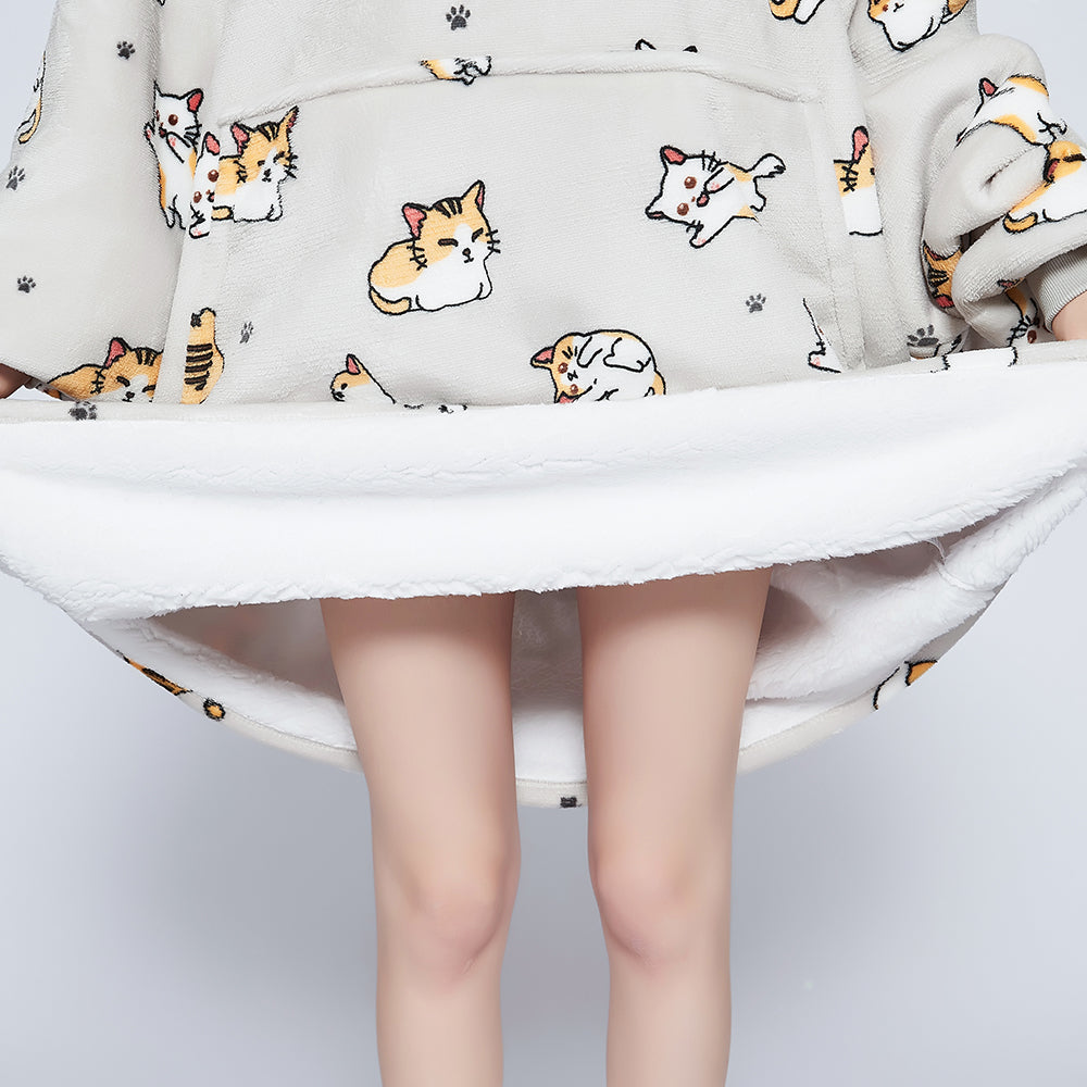 SNUGLFIT™ Hoodie Blanket in Kitten print, oversized wearable blanket with Sherpa fleece interior and flannel exterior, featuring a large pocket and hood for comfort and style.
