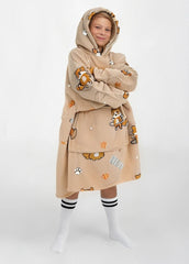 SNUGLFIT™ Hoodie Blanket Kids - Corgi design worn by a child, showcasing its oversized, cozy fit with a warm hood and playful corgi prints.